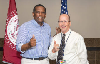 Faculty member with Representative Burgess Owens