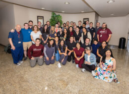 CORE students and faculty pose at the CORE birthday celebration