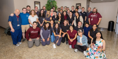 CORE students and faculty pose at the CORE birthday celebration