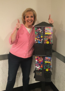 Kathy Ruggiero poses with a Treasure Tower® 