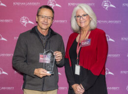 Dean Adam posing with Dr. Renee Coffman.