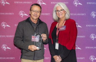 Dean Adam posing with Dr. Renee Coffman.