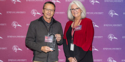 Dean Adam posing with Dr. Renee Coffman.