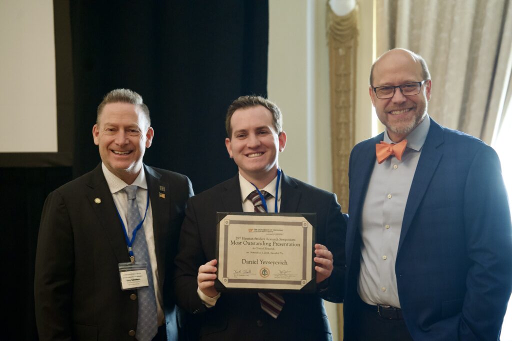 Daniel Yevseyevich with Award at the Hinman Student Research Symposium