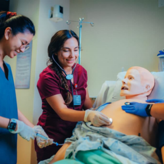 Nursing students working on test patient